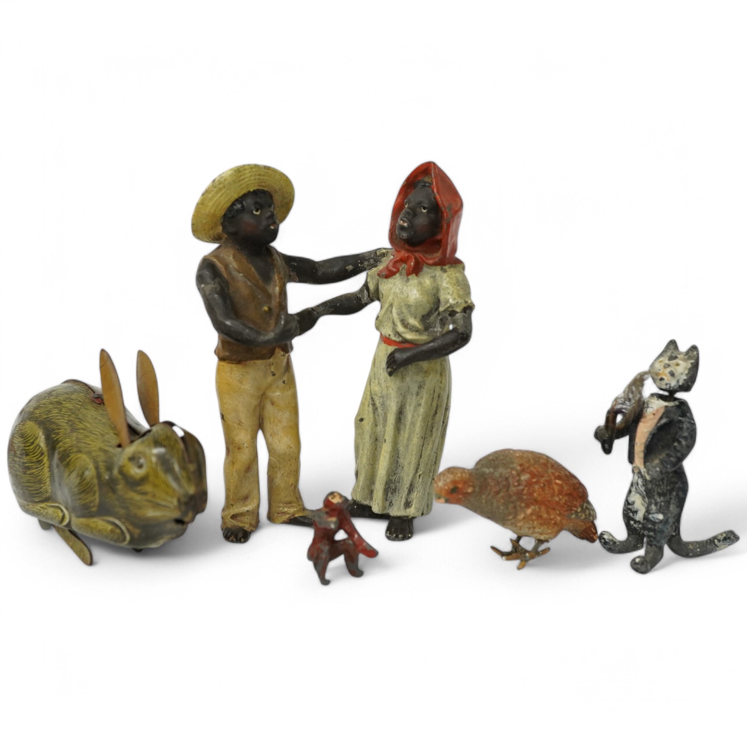 A collection of cold-painted figures and a tinplate and clockwork hare, largest 10cm high. Condition - fair